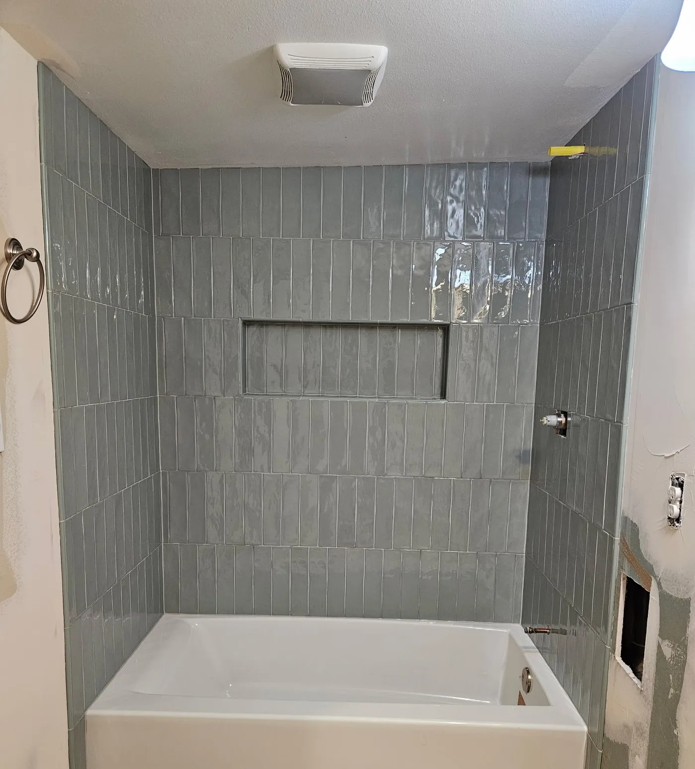 Custom walk-in shower with a pebble-tile floor